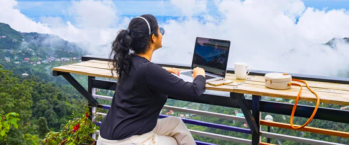 Tourist enjoying workcation in a homestay with a beautiful view of the nature in Chikmagalur